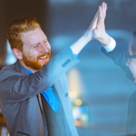 Two men giving each other a high five