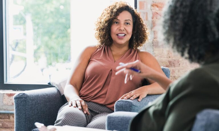 A business coach speaking with a client