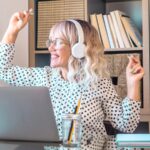 A woman dancing at her desk