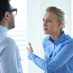 A woman having a conflict with a man in an office environment