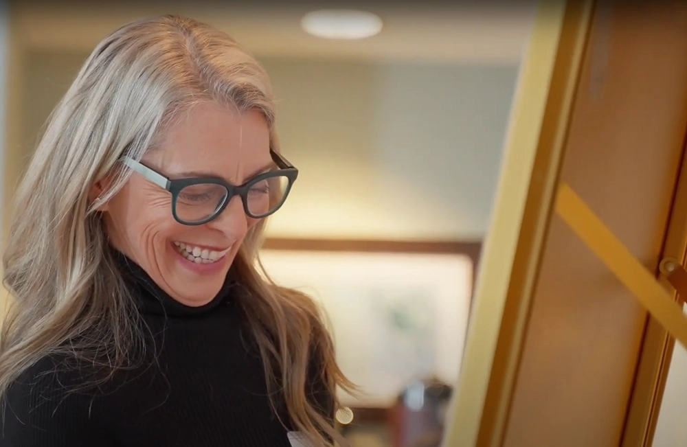 Nancy Burger smiling at a coaching workshop