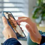 A woman taking a selfie on her phone