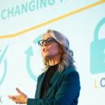 Nancy Burger speaking at an event about her Spot-Check-Flip-Lock framework