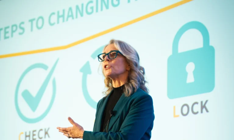 Nancy Burger speaking at an event about her Spot-Check-Flip-Lock framework